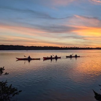 a sunset over a body of water
