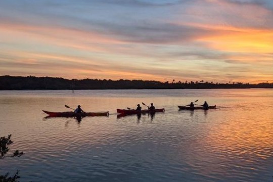 a sunset over a body of water