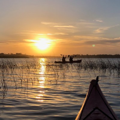 a sunset over a body of water