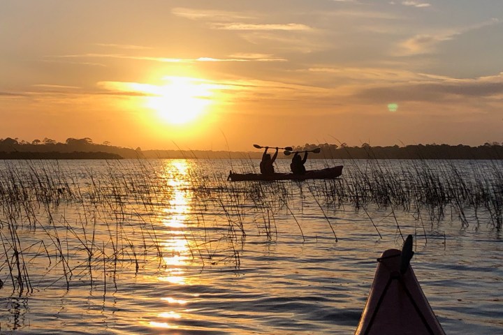 a sunset over a body of water